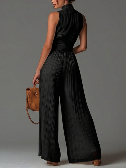 Black sleeveless V-neck jumpsuit with zipper and pleated wide legs in chiffon