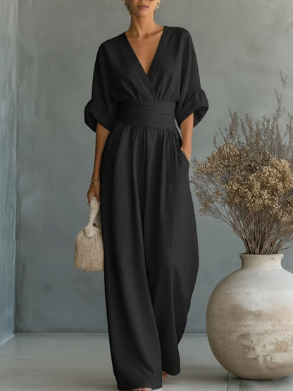 Elegant jumpsuit with V-neck, high waist, and wide leg